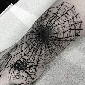 Tattoo A large spider web on the knee motif: dark style: graphic / illustrative