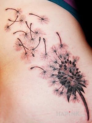Tattoo Dmuchawiec na wietrze in flowers motif and realistic style on the ribs