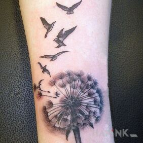 Tattoo Blower and birds on the forearm motif: black and gray style: graphic / illustrative