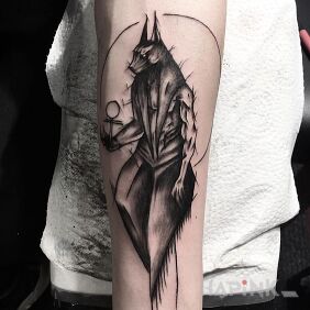 Tattoo Anubis on the forearm motif: characters style: sketch