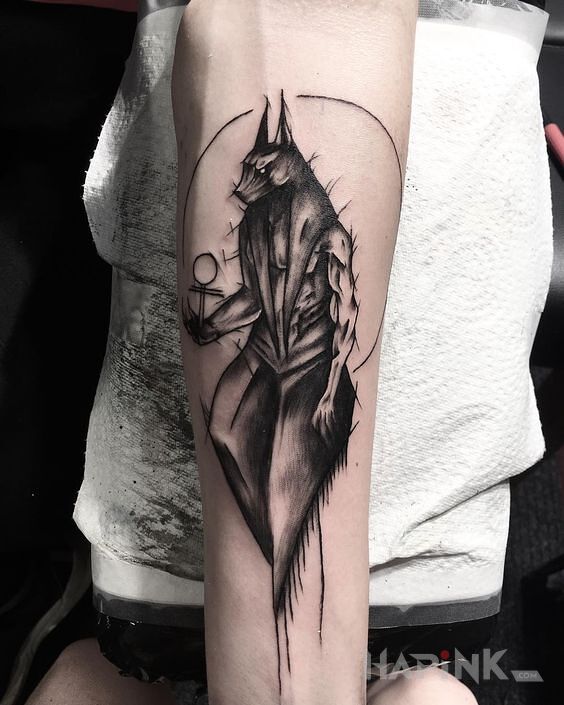 Tattoo Anubis in characters motif and sketch style on the forearm