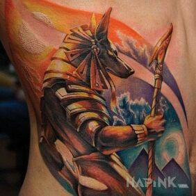 Tattoo Colorful anubis on the stomach motif: colorful style: graphic / illustrative
