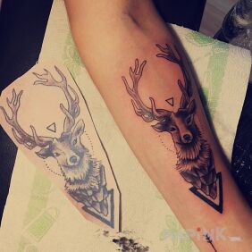 Tattoo Deer antler and arrow on the forearm motif: animals style: graphic / illustrative