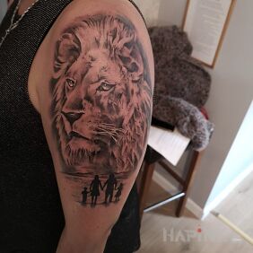 Tattoo Lion and family on the upper arm motif: characters style: realistic