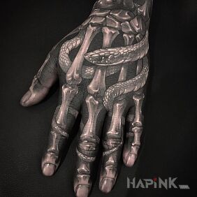 Tattoo Snake between fingers on the fingers motif: anatomical style: realistic