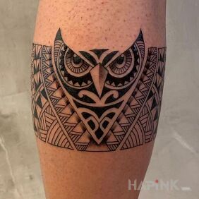 Tattoo Polynesian owl on the forearm motif: black and gray style: Polynesian