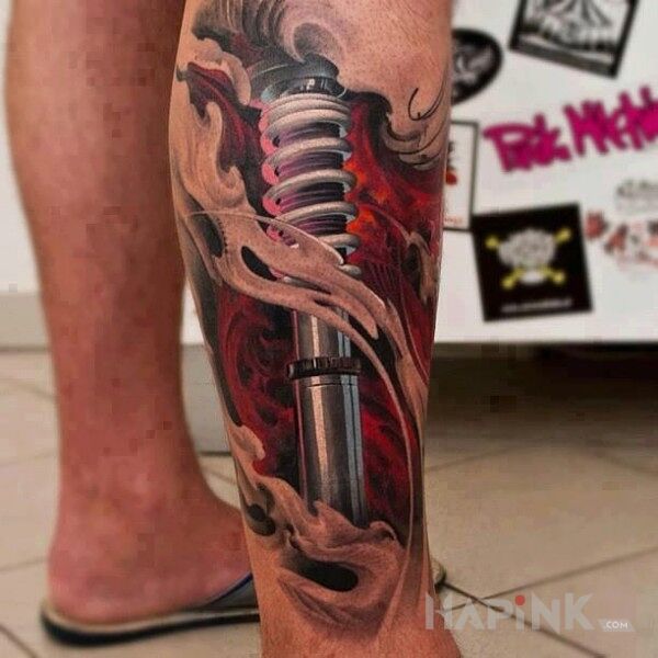 Tattoo Tłok in motorization motif and realistic style on the calf