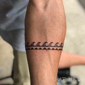 Tattoo Waves on the forearm motif: black and gray style: Polynesian