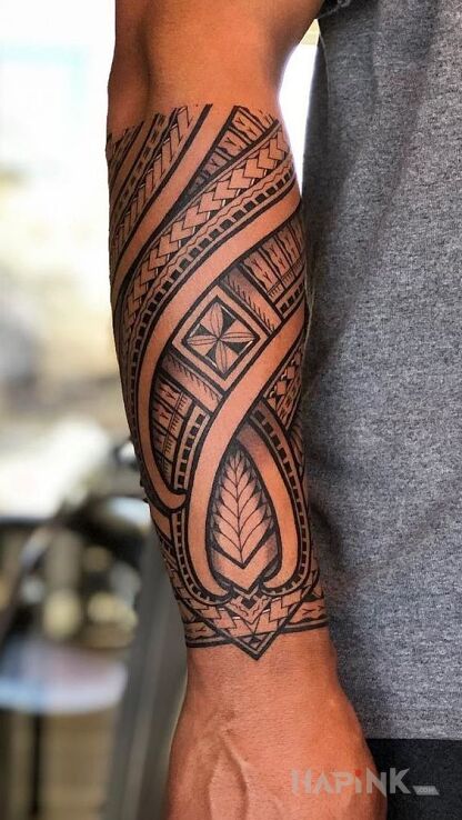 Tattoo Tatuaż mauri in black and gray motif and Polynesian style on the forearm