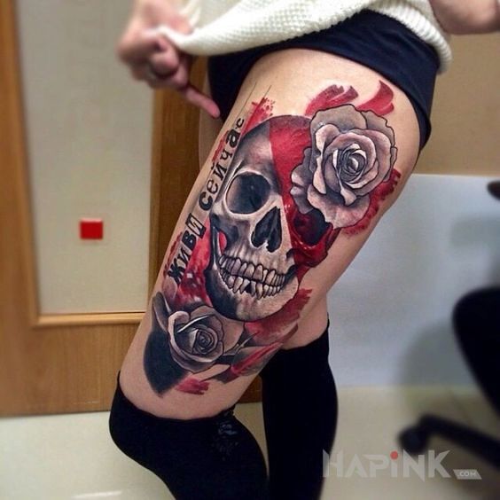 Tattoo Czaszka kolo rozy in colorful motif and trash polka style on the leg