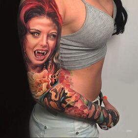 Tattoo Vampiress on the upper arm motif: faces style: realistic