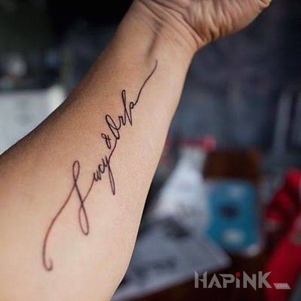 Tattoo Dwa imiona in lettering motif on the forearm