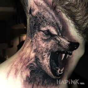 Tattoo The roar of the wolf on the neck motif: black and gray style: realistic