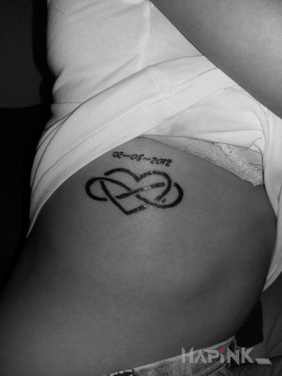 Tattoo Nieskończona miłość in Love motif on the ribs