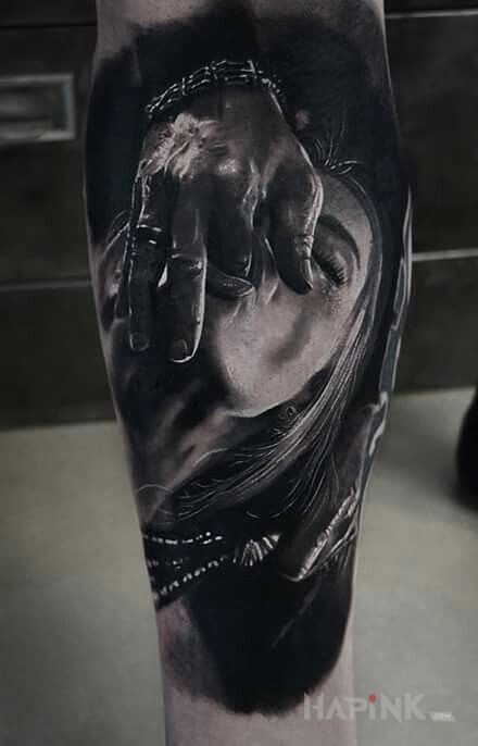 Tattoo Palce lizać in faces motif and realistic style on the calf