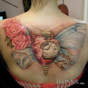 Tattoo Moth on the back motif: flowers