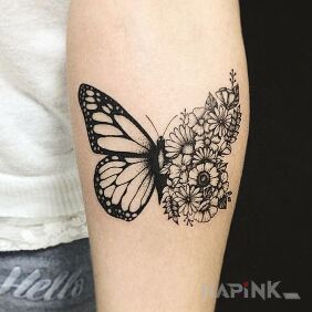 Tattoo Floral butterfly on the forearm motif: black and gray style: graphic / illustrative