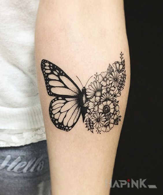 Tattoo Kwiecisty motyl in black and gray motif and graphic / illustrative style on the forearm