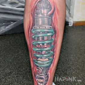 Tattoo Tatoo on the calf motif: colorful style: biomechanics