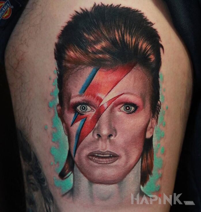 Tattoo David Bowie in characters motif on the upper arm