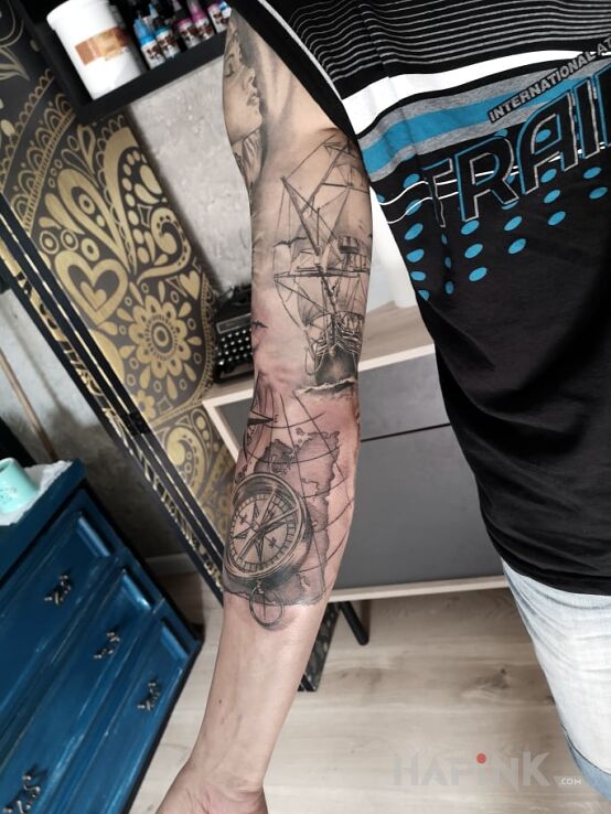 Tattoo Morskie klimaty in black and gray motif and realistic style on the forearm