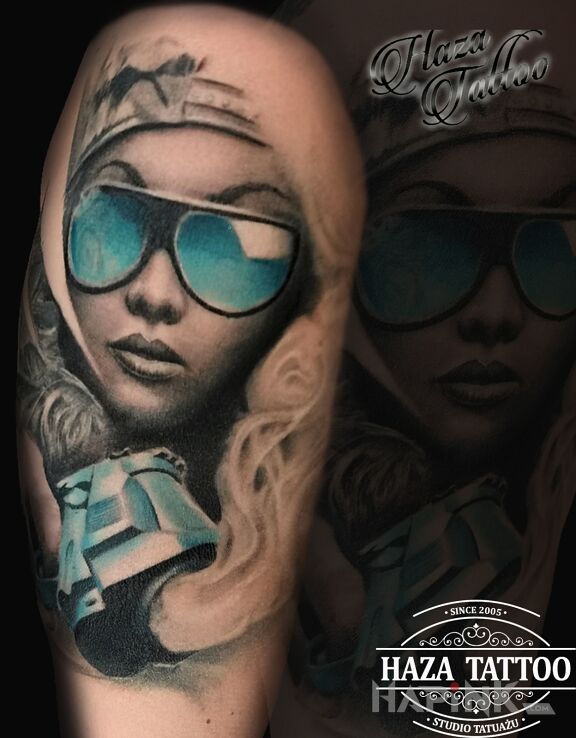 Tattoo Pistolet in objects motif and realistic style on the upper arm