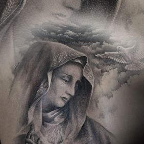 Tattoo Mary on the ribs motif: black and gray style: realistic