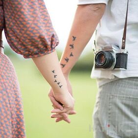 Tattoo Common birds on the forearm motif: Love style: minimalistic