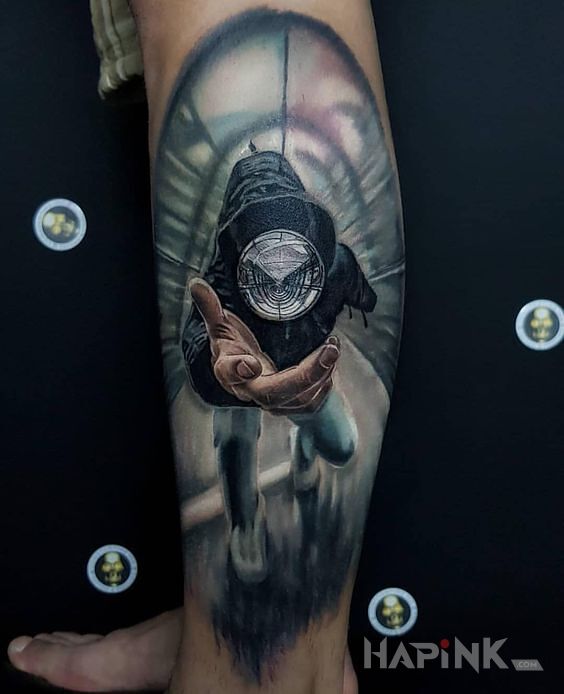 Tattoo Kuleczka in colorful motif and realistic style on the calf