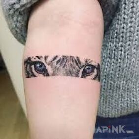 Tattoo Eye of the tiger on the forearm motif: animals style: graphic / illustrative