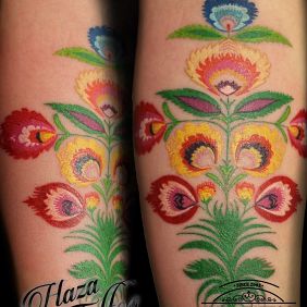 Tattoo Łowicko on the forearm motif: colorful style: embroidered