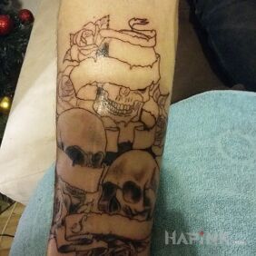 Tattoo Skulls on the forearm motif: skulls