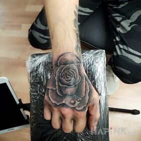 Tattoo Roses C.D.N on the hand motif: flowers style: realistic