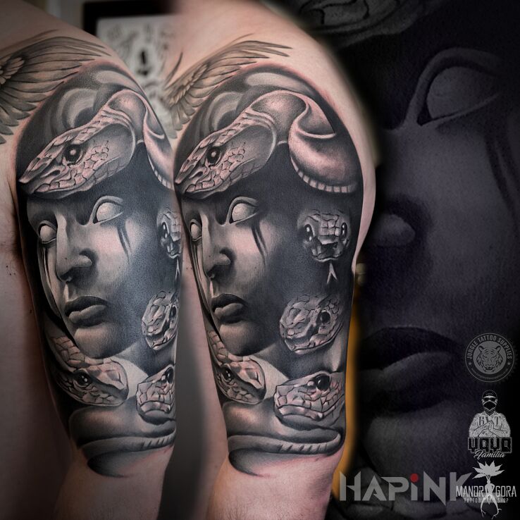Tattoo Medusa in animals motif and realistic style on the upper arm