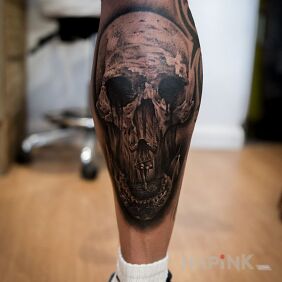 Tattoo Skull on the calf motif: black and gray style: realistic