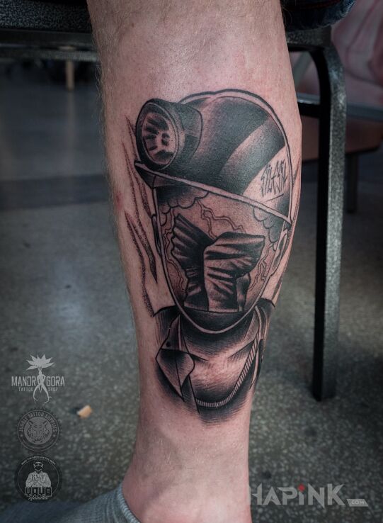 Tattoo Górnik in characters motif and graphic / illustrative style on the calf