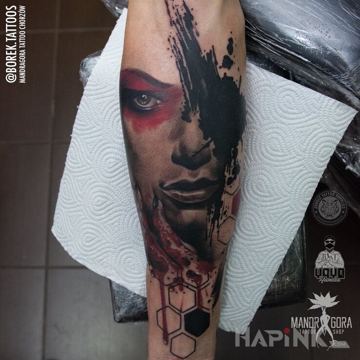 Tattoo Trashpolka - twarz in faces motif and trash polka style on the forearm