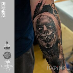 Tattoo Face on the forearm motif: demons style: realistic