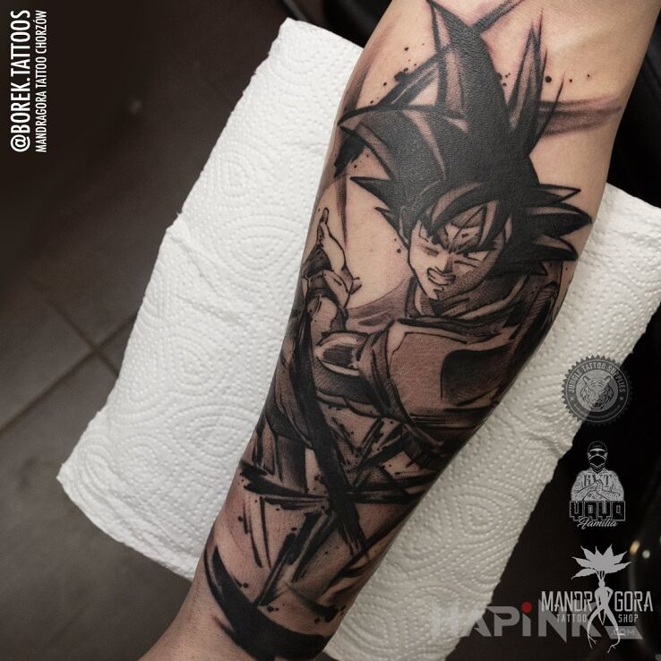 Tattoo Son Goku in black and gray motif and graphic / illustrative style on the forearm