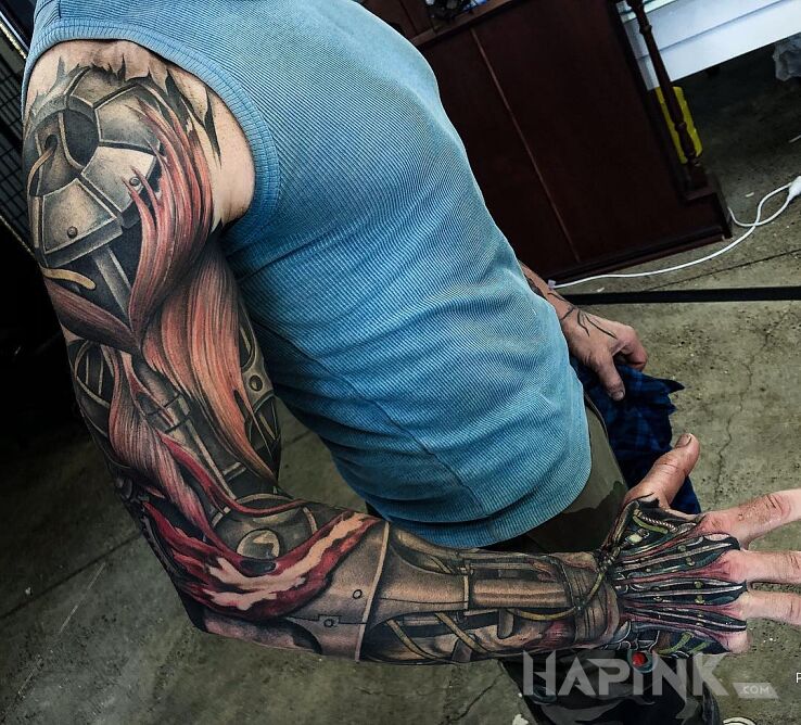 Tattoo Cyborg in sleeves motif and realistic style on the hand