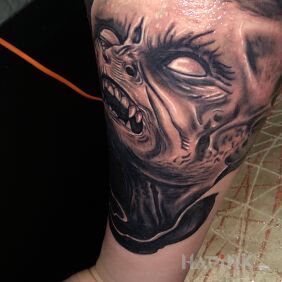 Tattoo Demon on the forearm motif: black and gray style: realistic