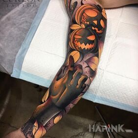 Tattoo Bad pumpkins on the upper arm motif: sleeves style: neo-traditional