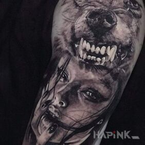 Tattoo Woman/Wolf on the upper arm motif: faces style: realistic