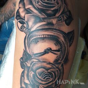 Tattoo Time And Roses on the upper arm motif: black and gray style: realistic