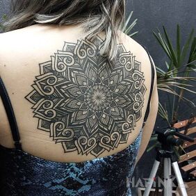 Tattoo Geometric pattern on the back motif: mandalas style: geometric