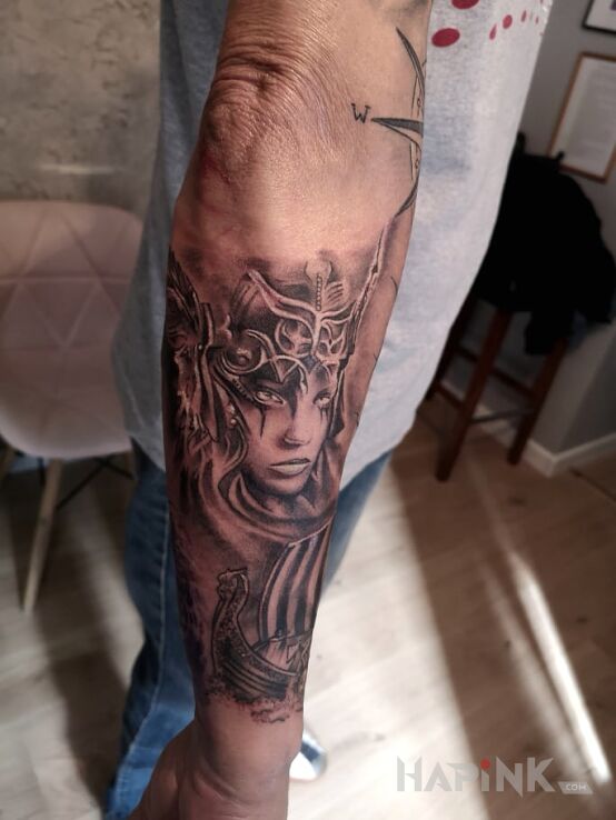 Tattoo Bogini Sif żona Thora. Normanka in faces motif and realistic style on the forearm