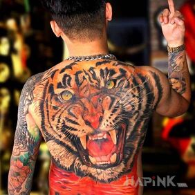 Tattoo Angry tiger on the shoulder blades motif: colorful style: realistic
