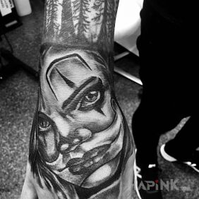 Tattoo Female Clown on the hand motif: faces style: chicano
