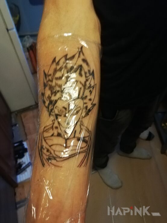 Tattoo Dragon Ball in black and gray motif and contour / linework style on the forearm