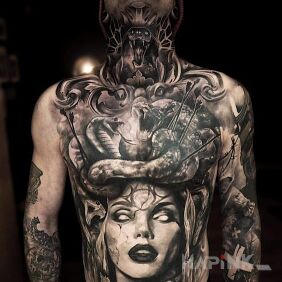 Tattoo White eyes in a woman on the collarbone motif: dark style: realistic